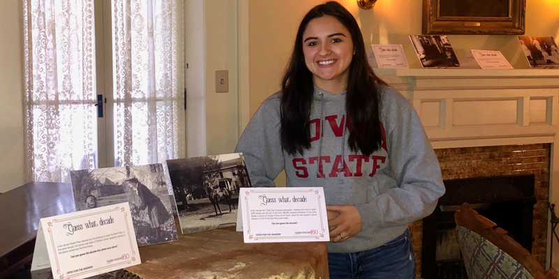 Madisyn Rostro posing with museum artifacts